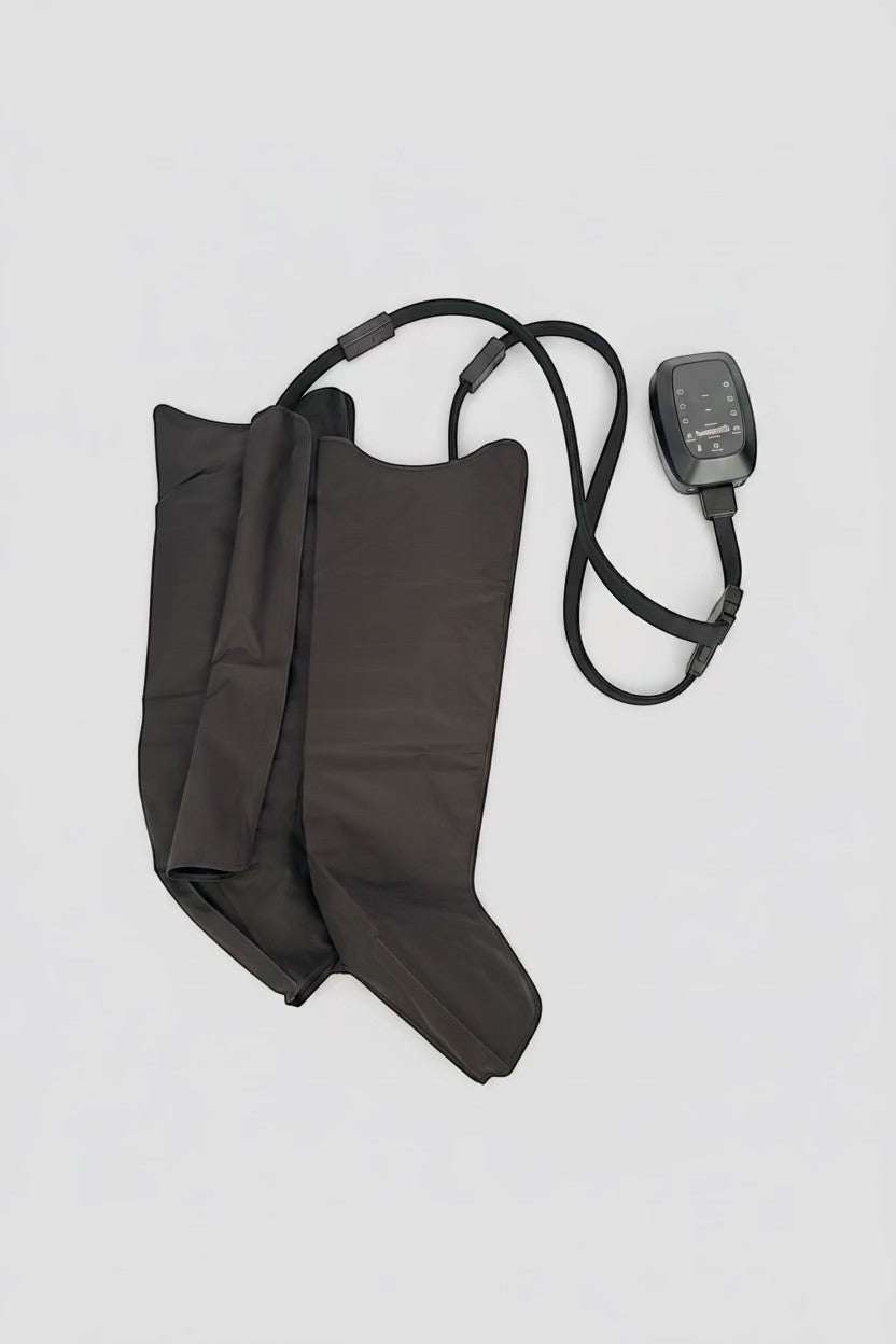 Elevate Performance Systems Apex Elite recovery boots in black with digital control unit for leg compression therapy.