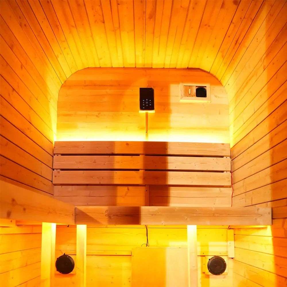Interior of Elevate Performance Systems Ember Mini sauna featuring warm LED lighting and light spruce wood benches.
