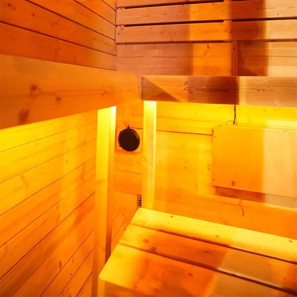 Elevate Performance Systems Ember Mini sauna interior with warm ambient lighting and light wood paneling
