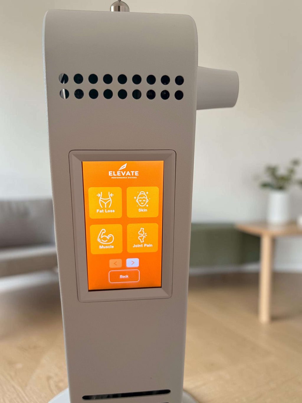 Elevate Performance Systems red light therapy panel with a digital touchscreen interface showing wellness settings.